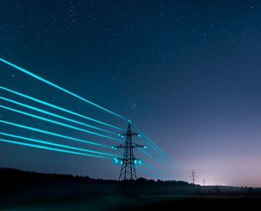 electricity-transmission-towers-with-glowing-wires-against-starry-sky web