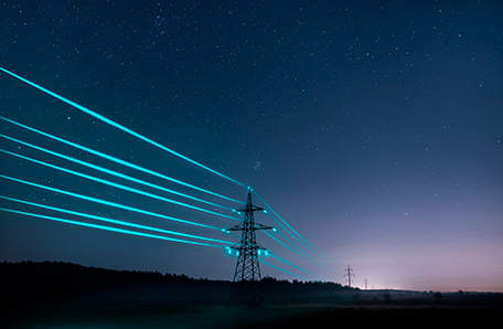 electricity-transmission-towers-with-glowing-wires-against-starry-sky web